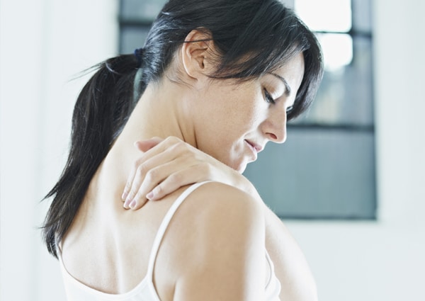 back pain woman rubbing neck